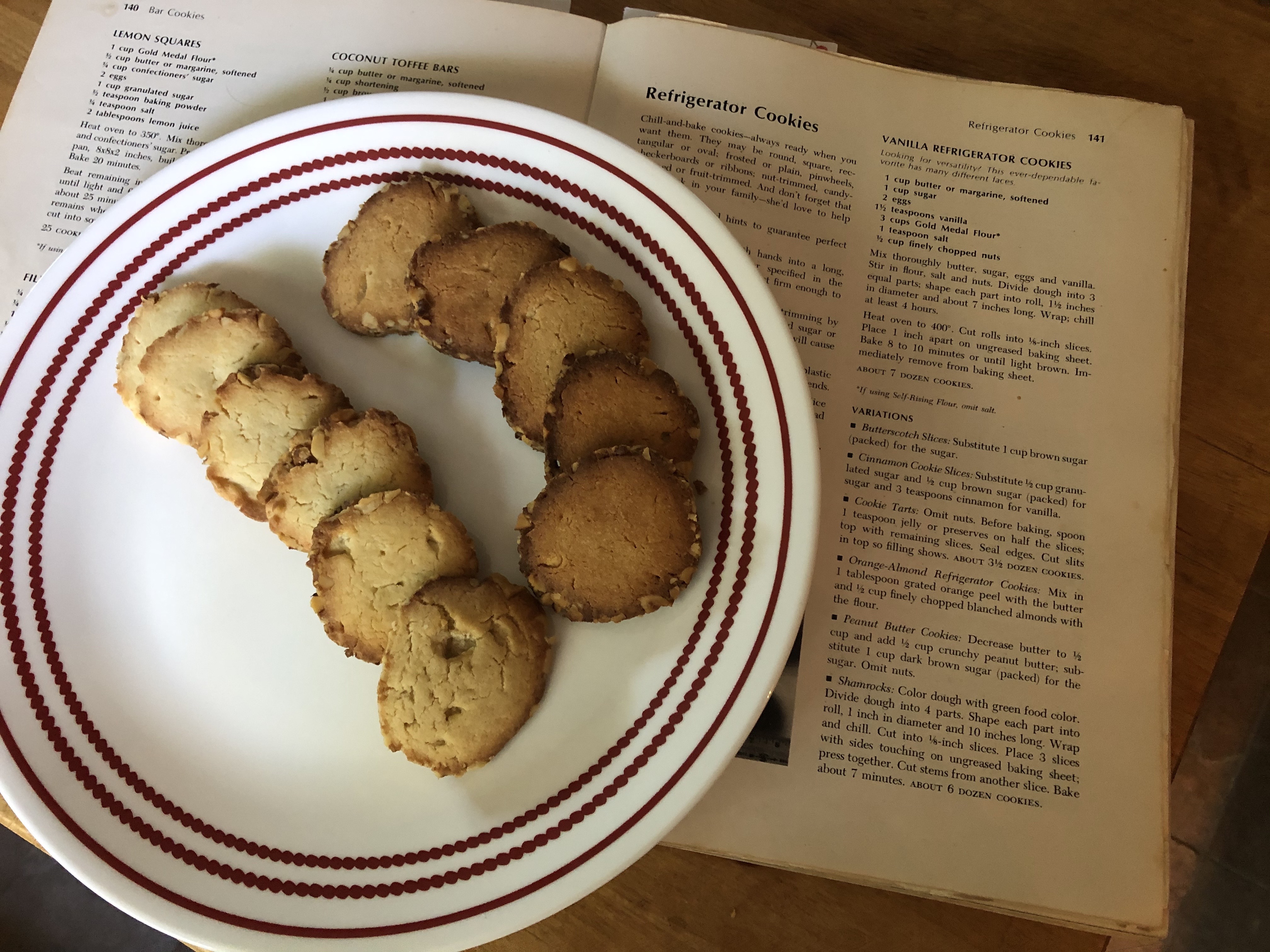 Cookies plated on top of cookbook